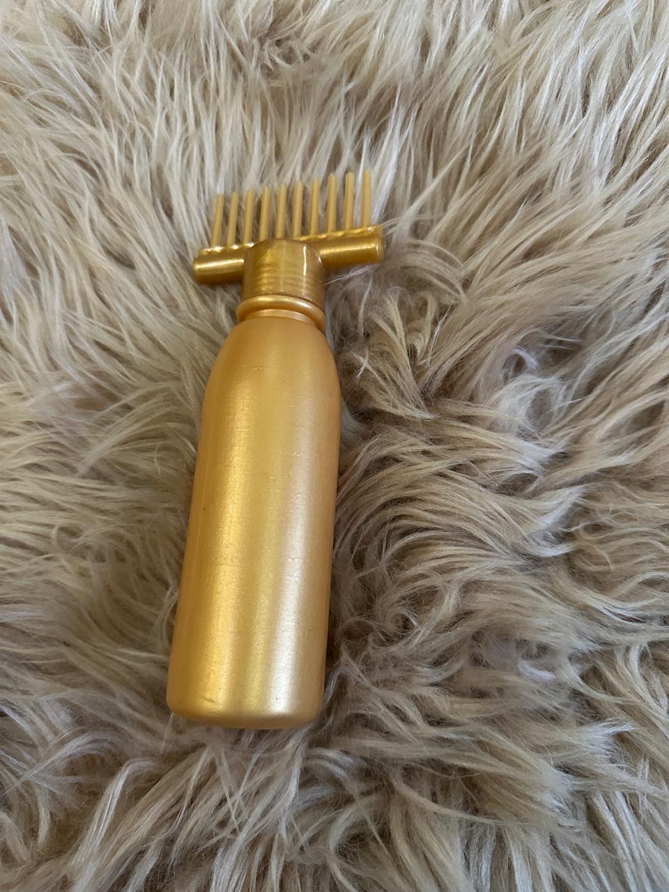 Hair oil bottle with comb